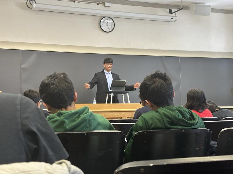 A student giving a speech with confidence in a live online class